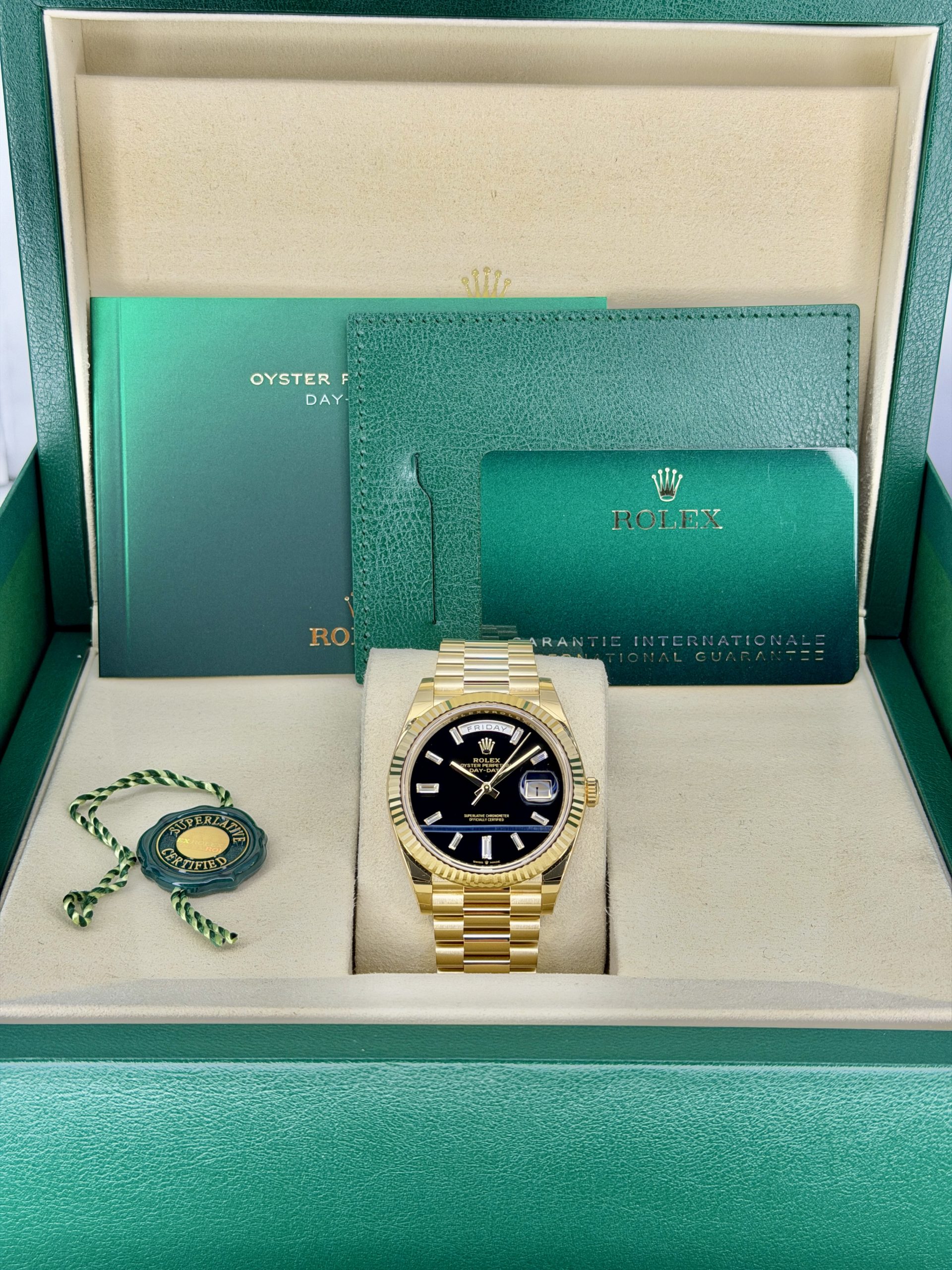 Box and Paperspre-owned Rolex Day-Date 228238 Onyx Baguettel